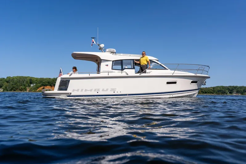  Yacht Photos Pics 2025 Nimbus 305 Coupe cruising on a sunny day, featuring sleek design and modern amenities.