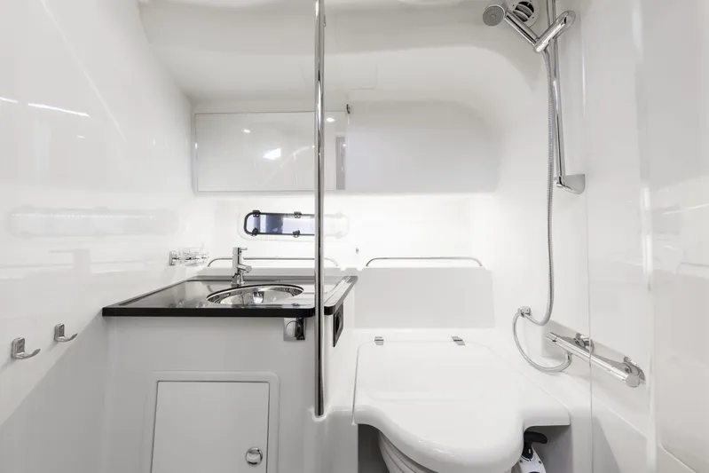  Yacht Photos Pics Modern bathroom in 2025 Nimbus 305 Coupe yacht with sleek fixtures and compact design.