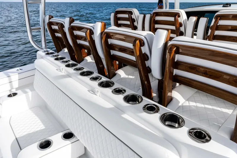  Yacht Photos Pics Luxury seating on 2026 Valhalla Boatworks V-46, featuring elegant wood and white upholstery.