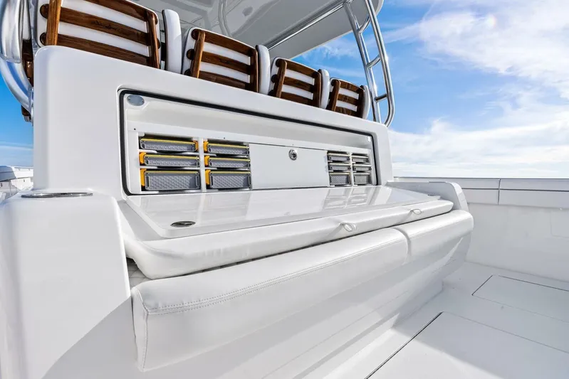  Yacht Photos Pics 2026 Valhalla Boatworks V-46 deck with seating and storage, under clear blue sky.