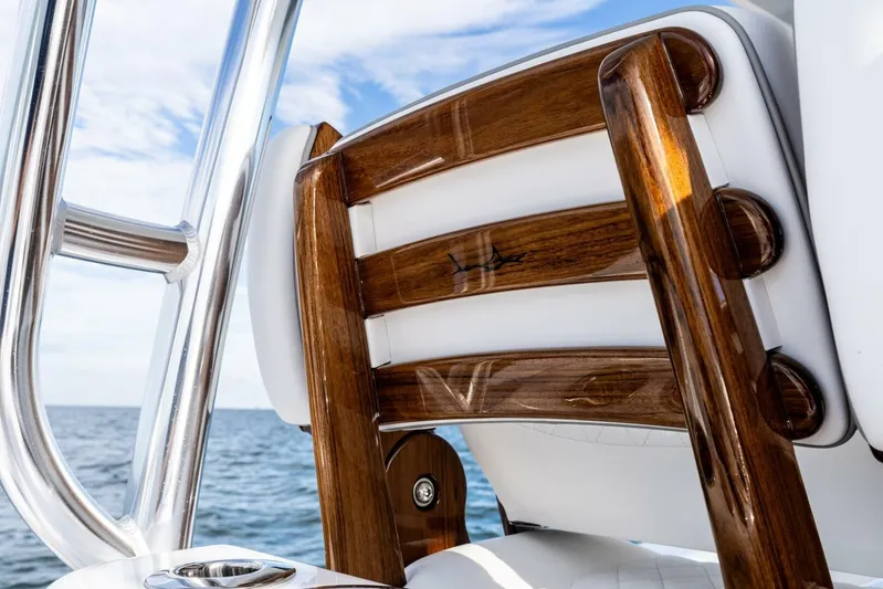  Yacht Photos Pics 2026 Valhalla Boatworks V-46, luxurious wooden seating detail, ocean backdrop.