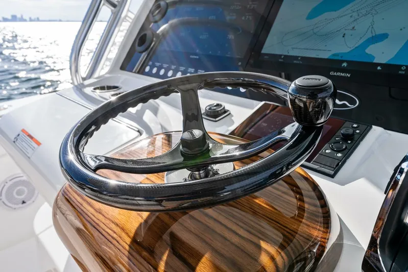  Yacht Photos Pics Steering wheel of 2026 Valhalla Boatworks V-46 with navigation display in sunlight.