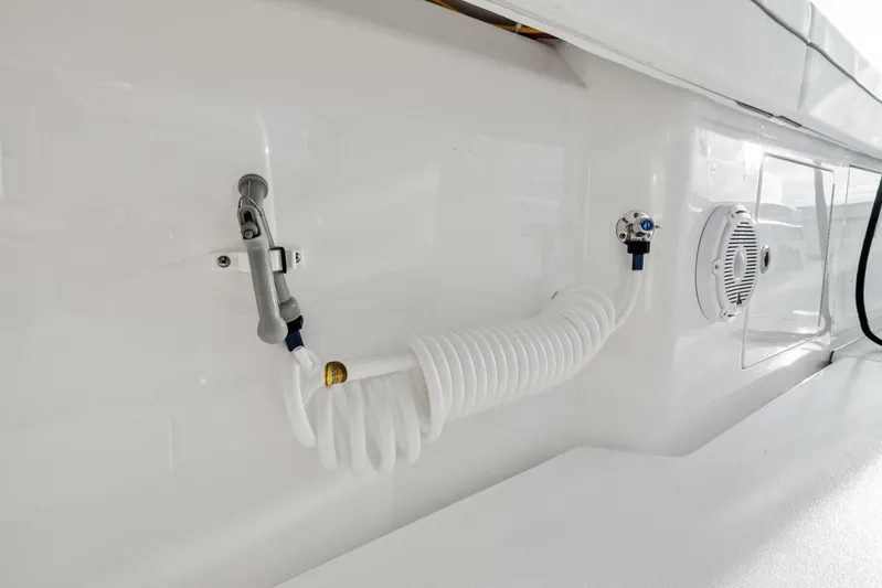  Yacht Photos Pics 2026 Valhalla Boatworks V-46 deck with coiled hose and speaker detail.