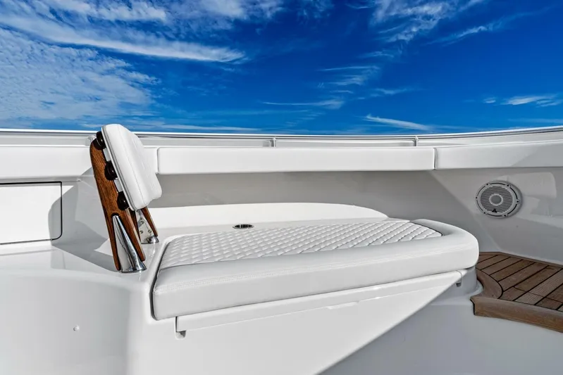  Yacht Photos Pics 2026 Valhalla Boatworks V-46, luxurious seating, white upholstery, clear blue sky background.