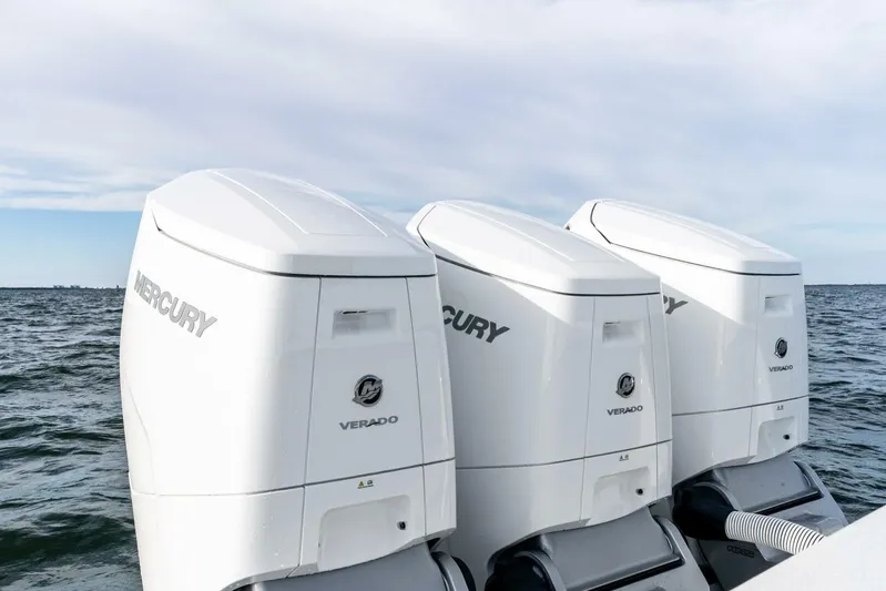  Yacht Photos Pics Triple Mercury Verado outboard engines on 2026 Valhalla Boatworks V-46, ocean backdrop.