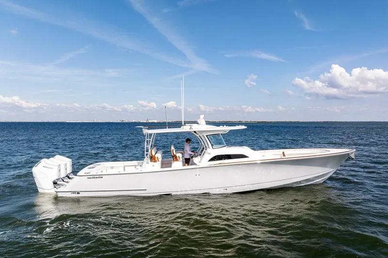  Yacht Photos Pics 2026 Valhalla Boatworks V-46 cruising on open water under a clear blue sky.