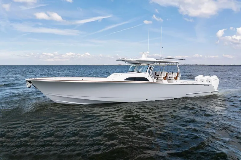  Yacht Photos Pics 2026 Valhalla Boatworks V-46 cruising on open water under a clear sky.