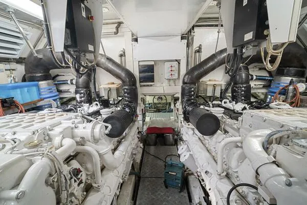  Yacht Photos Pics Engine room of 2001 Mangusta 72 Open yacht, showcasing dual engines and mechanical systems.