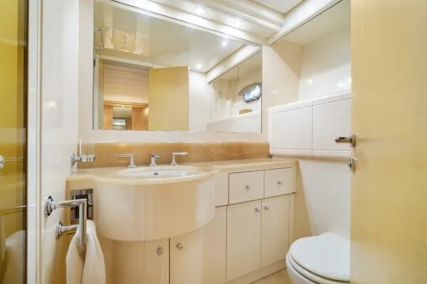  Yacht Photos Pics Luxurious bathroom interior of 2001 Mangusta 72 Open yacht, featuring modern fixtures and elegant design.