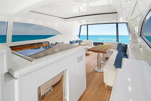  Yacht Photos Pics Luxurious interior of 2001 Mangusta 72 Open yacht with ocean view and elegant seating.