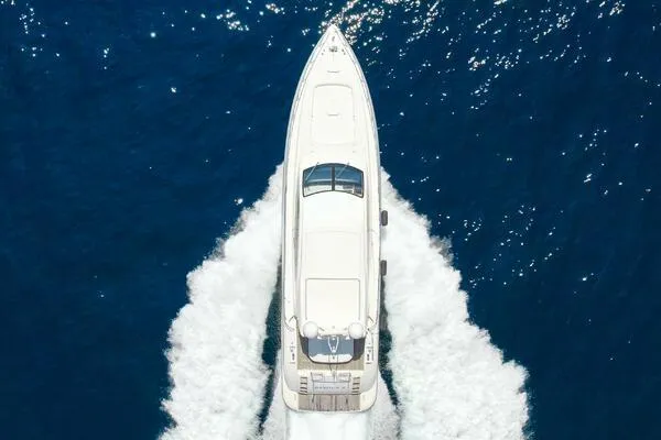  Yacht Photos Pics Mangusta 72 Open yacht cruising on blue ocean, aerial view, 2001 model.