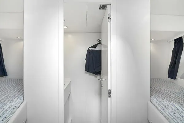  Yacht Photos Pics Interior of 2001 Mangusta 72 Open yacht with twin beds and modern design.