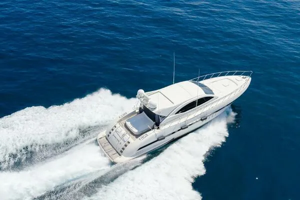  Yacht Photos Pics Mangusta 72 Open 2001 yacht cruising on open blue sea.