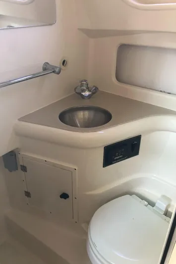  Yacht Photos Pics 2007 Pursuit 335 Offshore boat bathroom with sink and toilet.