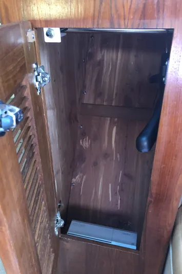  Yacht Photos Pics Wooden storage compartment inside a 2007 Pursuit 335 Offshore boat.