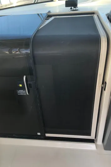  Yacht Photos Pics 2007 Pursuit 335 Offshore cabin door with sleek design and modern handle.