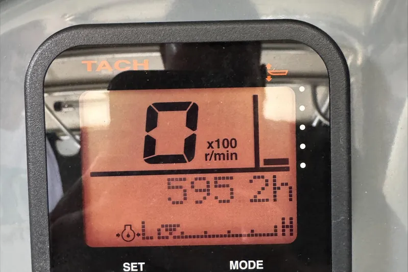  Yacht Photos Pics Tachometer display of 2007 Pursuit OS 335 Offshore showing 595.2 hours.