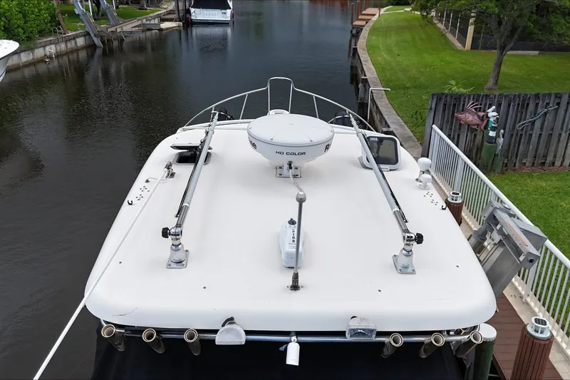  Yacht Photos Pics 2007 Pursuit OS 335 Offshore boat docked in a canal, aerial view.