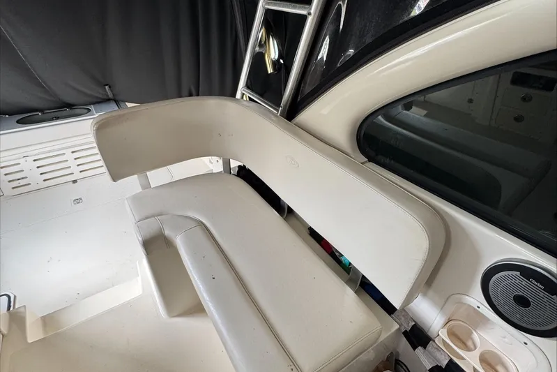  Yacht Photos Pics 2007 Pursuit OS 335 Offshore boat interior seating area with cup holders.