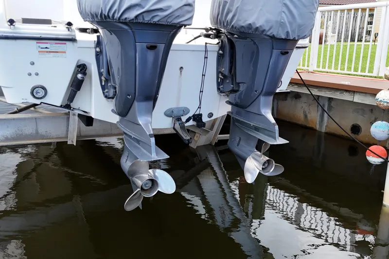  Yacht Photos Pics 2007 Pursuit OS 335 Offshore boat with dual outboard motors in docked position.