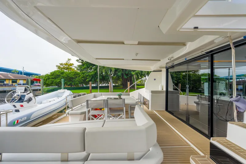 Freedom Yacht Photos Pics Luxurious 2022 Leopard 53 Powercat yacht deck with seating and modern amenities.