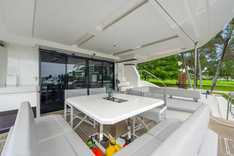 Freedom Yacht Photos Pics Luxurious outdoor seating area on a 2022 Leopard 53 Powercat yacht.
