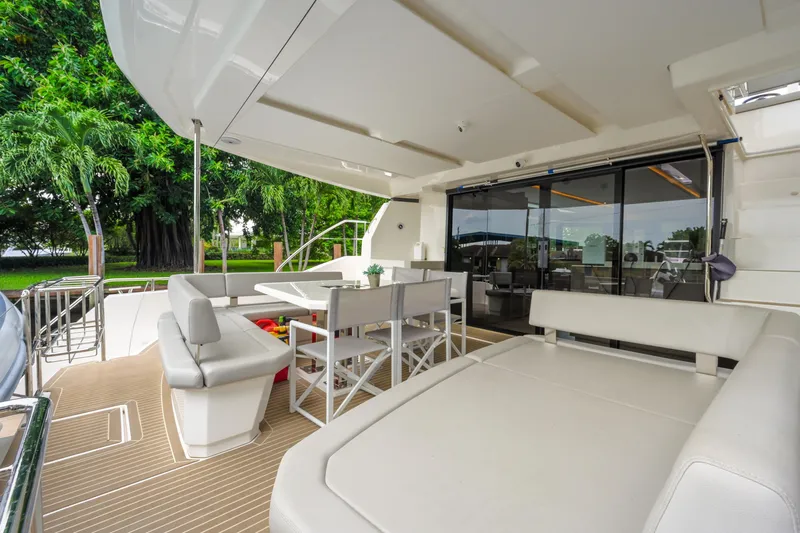 Freedom Yacht Photos Pics Luxurious 2022 Leopard 53 Powercat yacht with spacious outdoor seating and dining area.