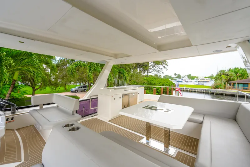 Freedom Yacht Photos Pics Luxurious 2022 Leopard 53 Powercat yacht interior with modern seating and dining area.
