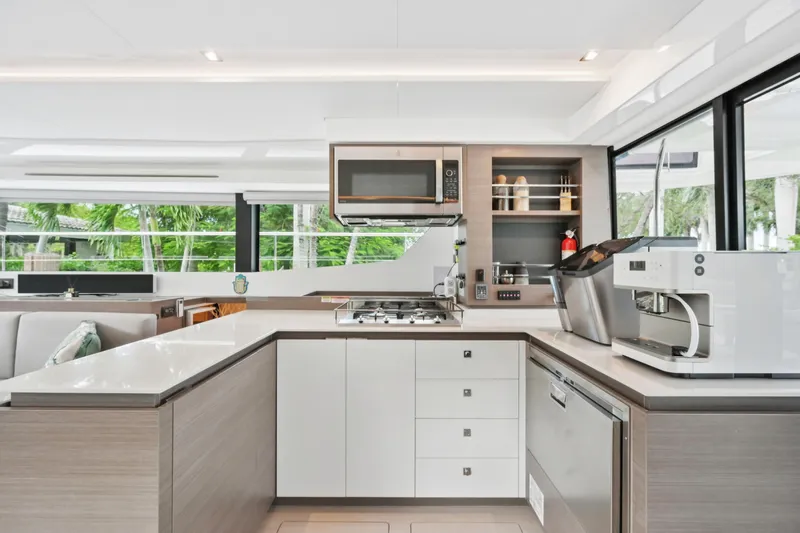 Freedom Yacht Photos Pics Modern kitchen interior on 2022 Leopard 53 Powercat yacht, featuring sleek appliances and ample counter space.