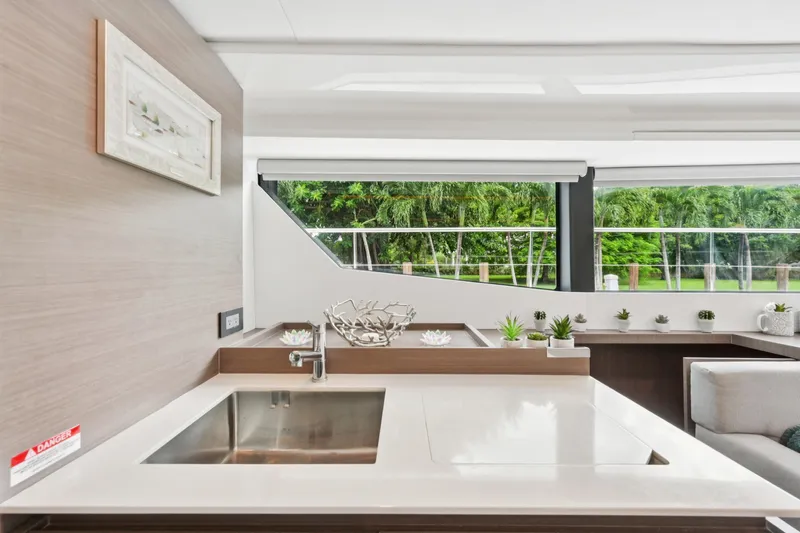 Freedom Yacht Photos Pics Modern kitchen interior on 2022 Leopard 53 Powercat yacht, featuring sleek design and greenery.