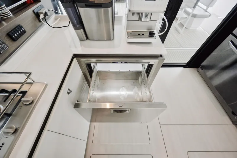 Freedom Yacht Photos Pics Modern kitchen on 2022 Leopard 53 Powercat with open drawer and appliances.