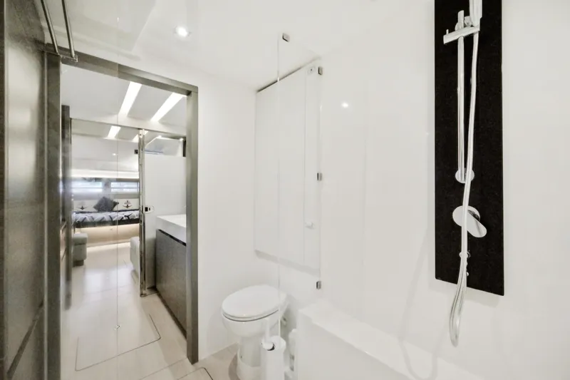 Freedom Yacht Photos Pics Modern bathroom interior on 2022 Leopard 53 Powercat yacht, featuring sleek design and luxury amenities.