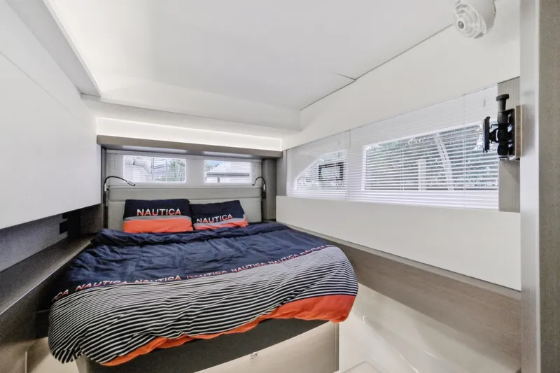 Freedom Yacht Photos Pics Luxurious bedroom interior of 2022 Leopard 53 Powercat yacht with modern design.