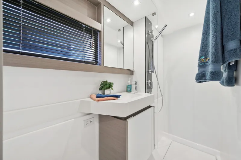 Freedom Yacht Photos Pics Modern bathroom on 2022 Leopard 53 Powercat yacht with sleek design and elegant fixtures.
