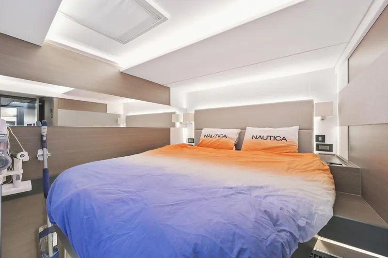 Freedom Yacht Photos Pics Luxurious bedroom interior of 2022 Leopard 53 Powercat with modern design and ambient lighting.