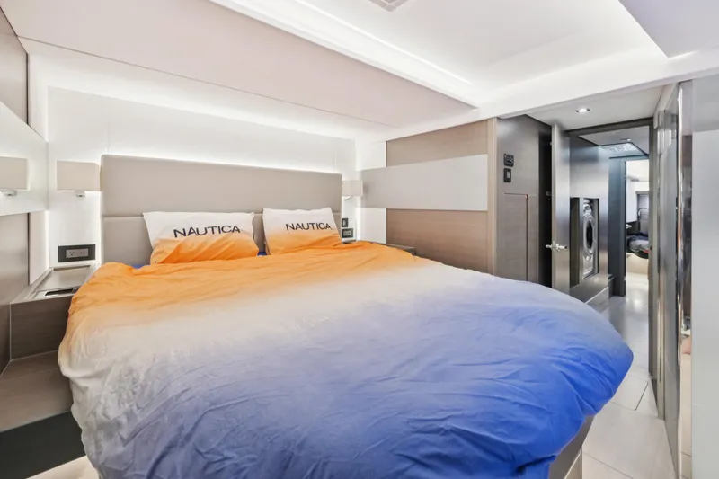 Freedom Yacht Photos Pics Luxurious bedroom interior of 2022 Leopard 53 Powercat yacht with gradient bedding.
