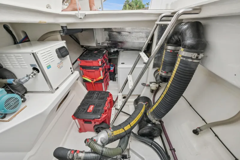 Freedom Yacht Photos Pics Engine room of 2022 Leopard 53 Powercat with equipment and storage boxes.