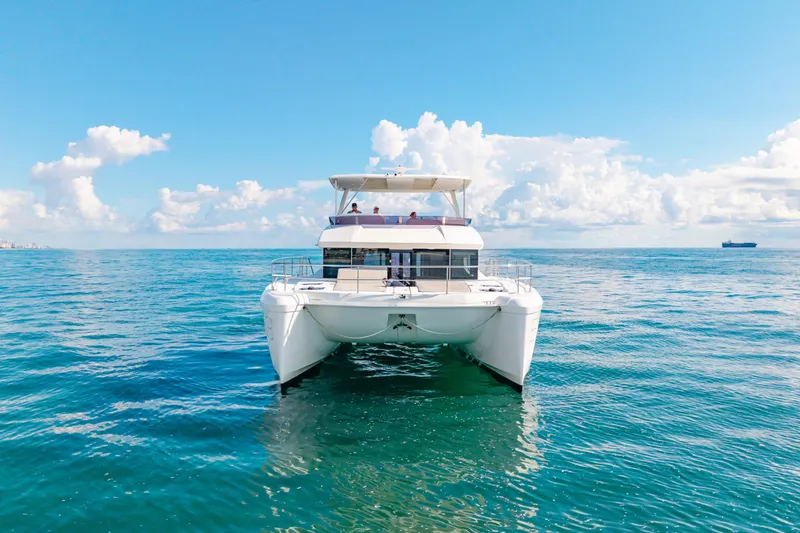 Freedom Yacht Photos Pics 2022 Leopard 53 Powercat yacht on open sea under clear blue sky.