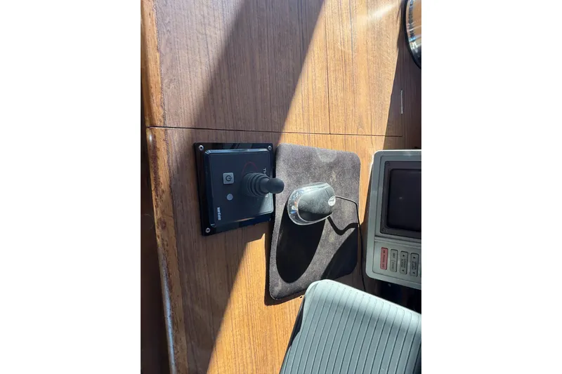 Maximon Yacht Photos Pics Control panel and joystick on 1989 Grand Banks 46 yacht, wooden dashboard.