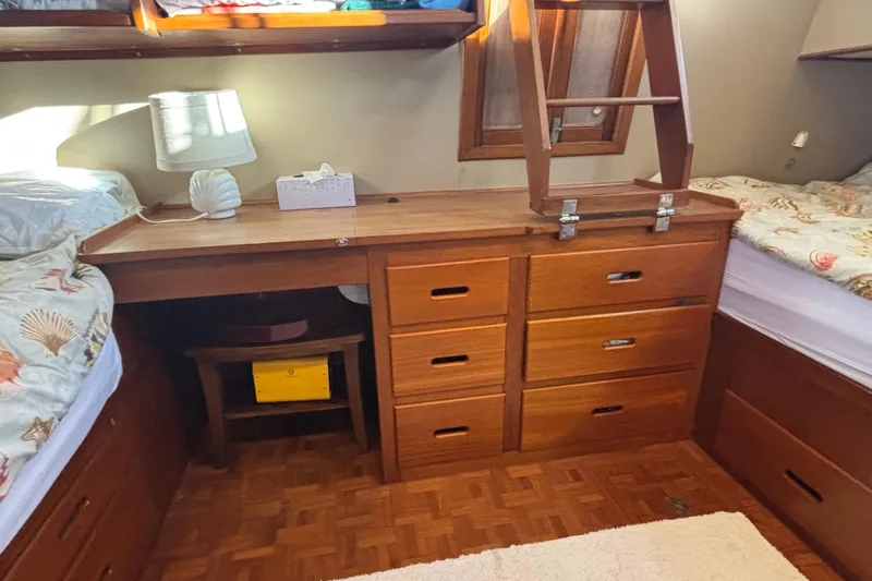 Maximon Yacht Photos Pics Interior of 1989 Grand Banks 46 yacht with wooden cabinetry and twin beds.