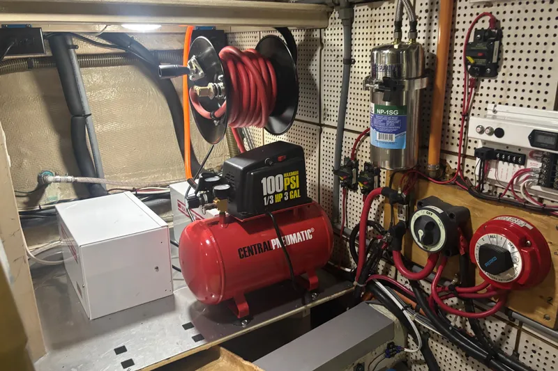 Maximon Yacht Photos Pics Engine room of 1989 Grand Banks 46 with compressor and electrical components.