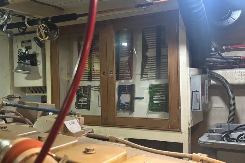 Maximon Yacht Photos Pics Engine room of 1989 Grand Banks 46 yacht with organized wiring and equipment.