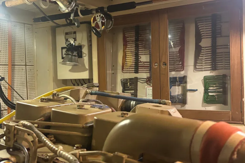 Maximon Yacht Photos Pics Engine room of 1989 Grand Banks 46 yacht with visible wiring and equipment.