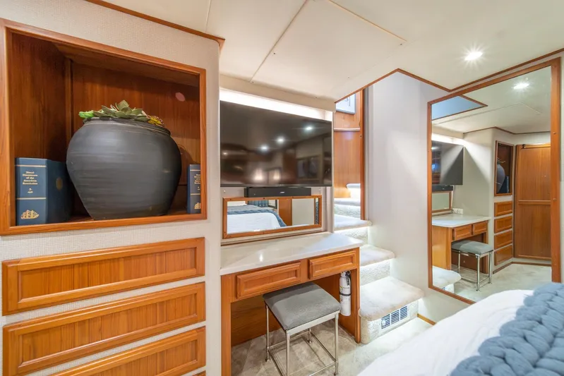 Odisea Yacht Photos Pics Luxurious interior of 1995 Tollycraft 57 Walk Around Pilothouse with elegant wood cabinetry.