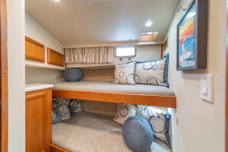 Odisea Yacht Photos Pics Cozy cabin with bunk beds in 1995 Tollycraft 57 Walk Around Pilothouse yacht.