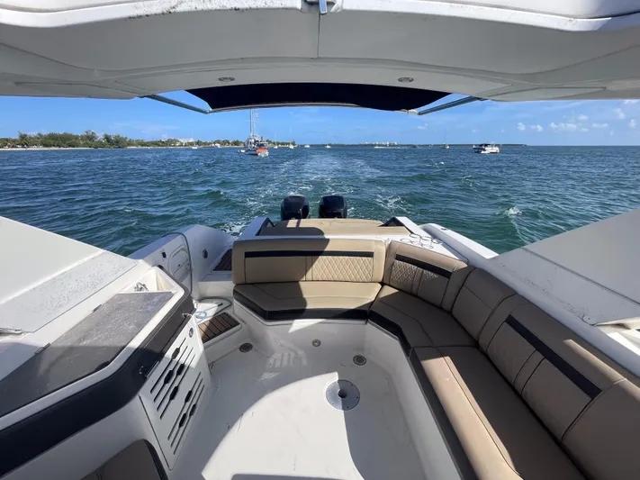  Yacht Photos Pics 2018 Sea Ray 310 SLX boat interior with seating, cruising on open water.
