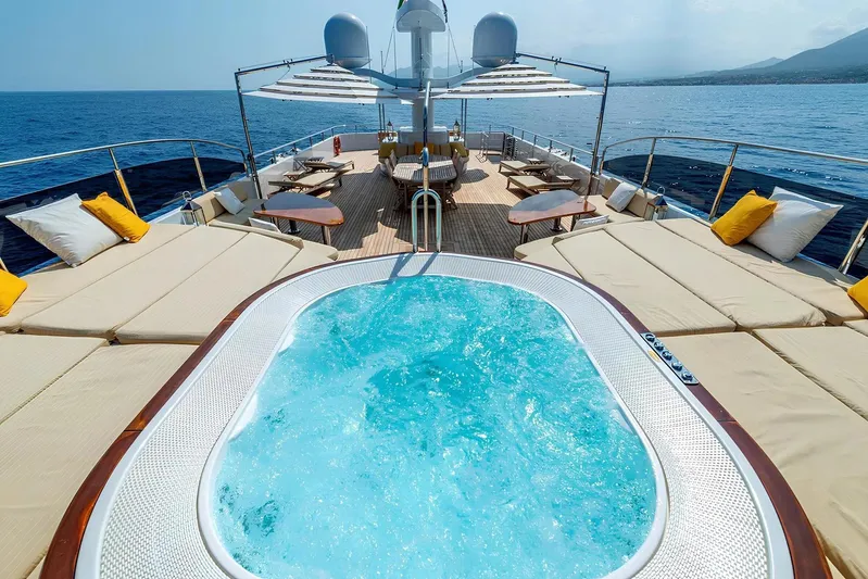 Baron Trenck Yacht Photos Pics Luxurious Eurocraft SUPERYACHT 43.5 (2011) deck with jacuzzi and sun loungers at sea.