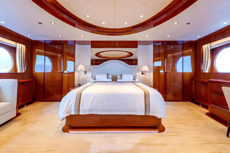 Baron Trenck Yacht Photos Pics Luxurious bedroom interior on Eurocraft SUPERYACHT 43.5, 2011 model, featuring elegant wood finishes.