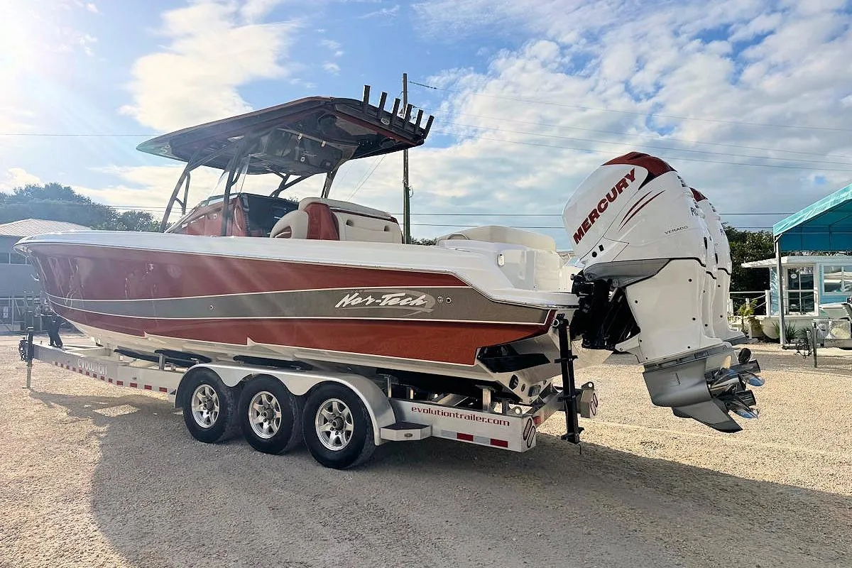 2016 Nor-Tech 340 Sport Center Console boat with Mercury engines on a trailer.