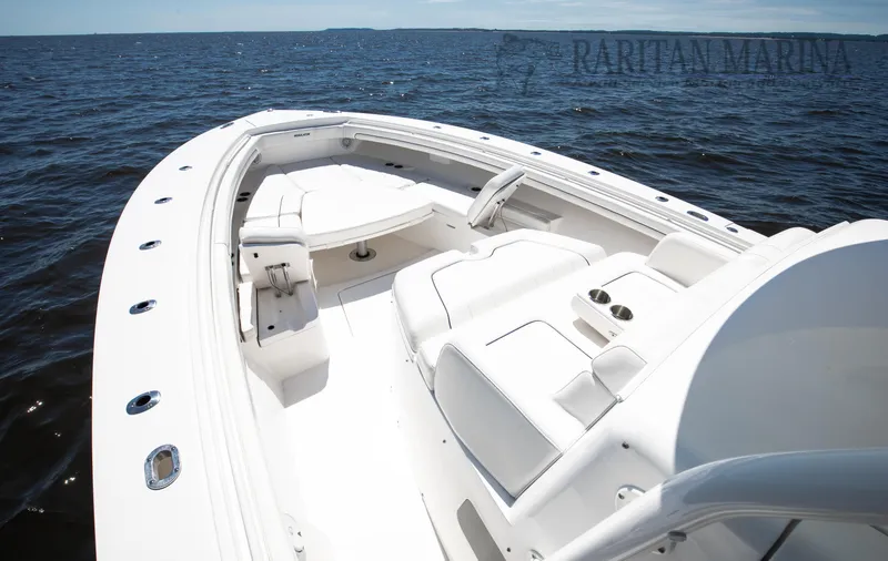 Thunder Reef V Yacht Photos Pics 2016 Regulator 41 boat with spacious seating on open water.